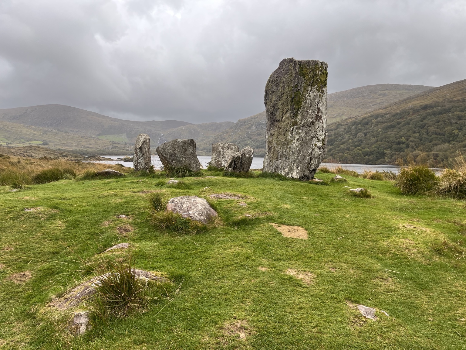 Stone, grass and water in a quiet arrangement.